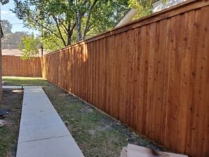 A wooden fence is shown with no one in it.